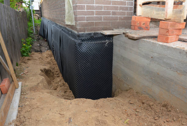 Happy homeowners after waterproofing job in Morrow